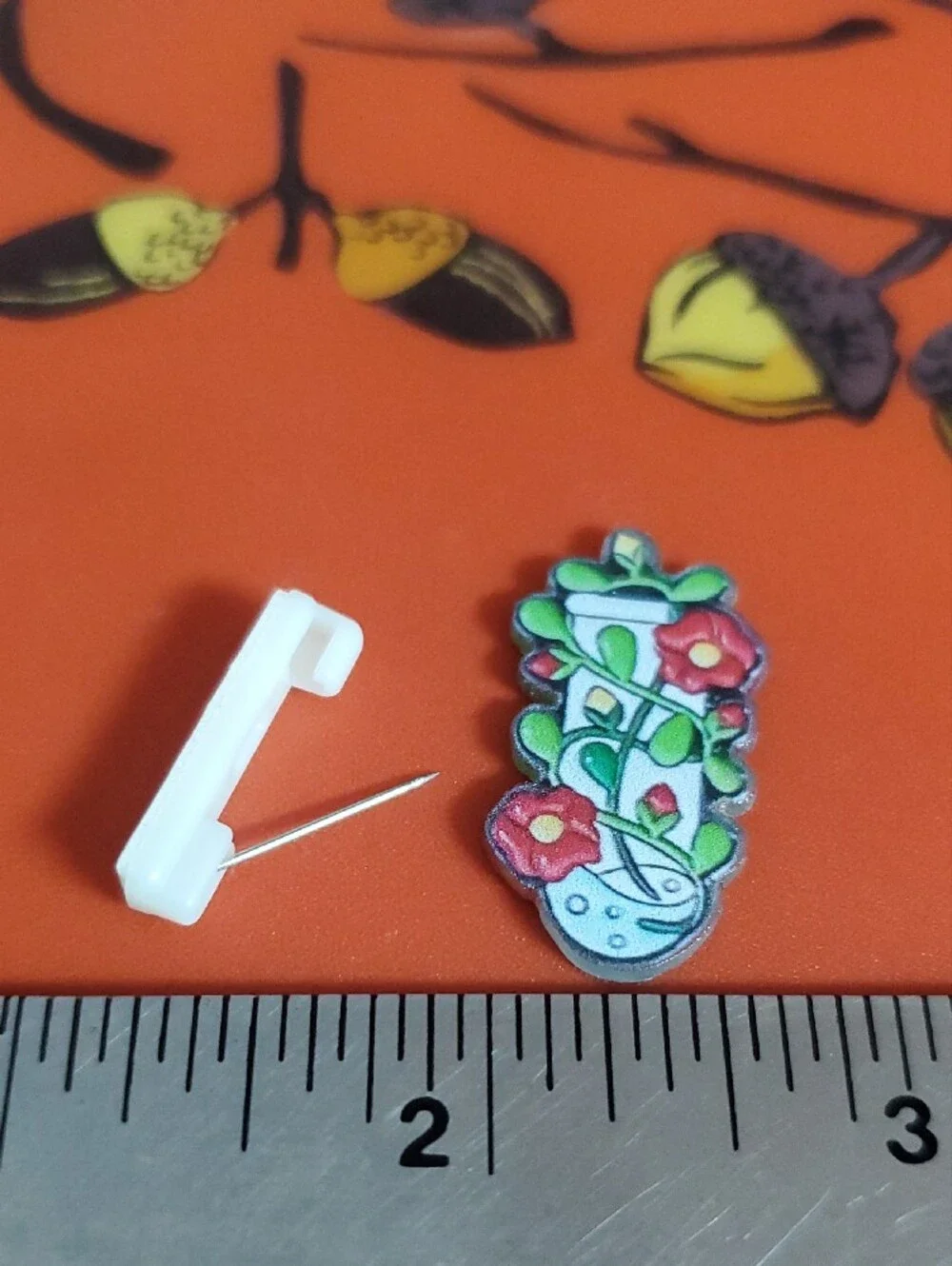 Floral Potion Acrylic Pin in Red, Green, White